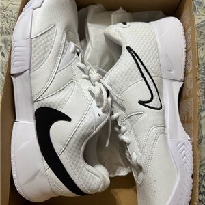 Nike Men's White Athletic Shoes with Black Swoosh. Pickleball